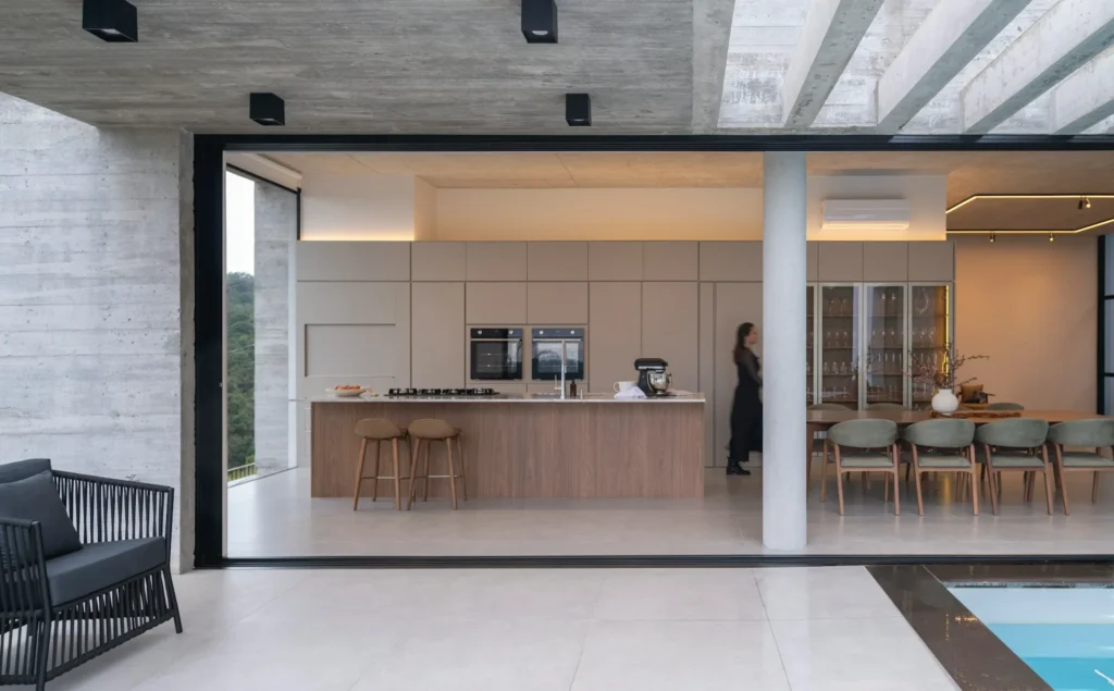 Modern kitchen with wood cabinetry and large central island.